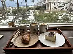 Food and drinks from the cafe, with rear garden visible outside (2023)