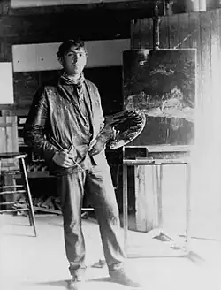 full length portrait of N.C. with his palette in his studio