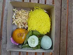 Nasi kuning kotak in paper box in Java