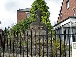 The weathered remains of a small stone monument
