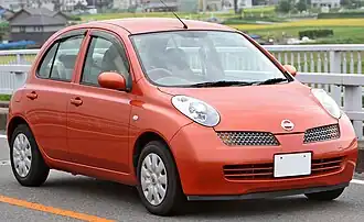 Small orange five-door car