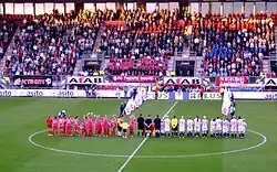 Women's soccer players from FC Twente & SC Heerenveen in a line on the soccer field in Enscede for the opening ceremony before the first Women's Eredivisie game on 29 August 2007