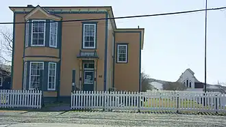 The O'Reilly House with St. Luke's Cultural Heritage Centre in the background.