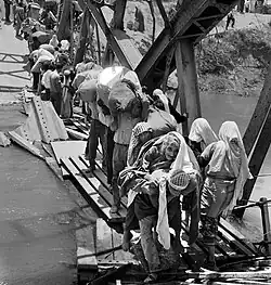 Palestine refugees flee across the Allenby Bridge during the second Arab-Israeli hostilities in 1967