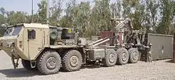 Oshkosh M1075A0 PLS truck fitted with the Armor Holdings developed protection package