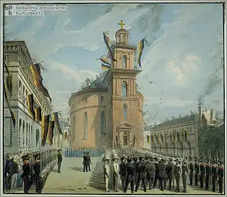Romanesque church, men marching into it, through a phalanx of uniformed men, houses and church are draped in banners and flags