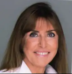 Portrait of Patrizia Polliotto, Italian lawyer, smiling in a professional headshot.