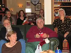 Williams reading from his book of cat haiku at the Yuki Teikei Holiday Party in 2006