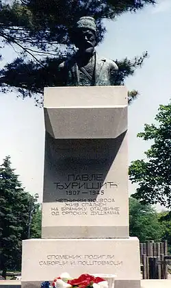 a concrete plinth with a bust on top of it