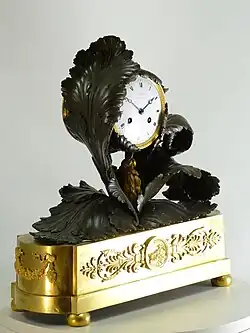 Neoclassical French ormolu and patinated bronze mantel clock, « Aux feuilles de chou » (with cabbage leaves). The clock case by Pierre-Victor Ledure, the clockwork by Claude Hémon (1770–1820)
