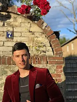 Head and shoulder photograph of subject of article