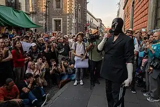 Fabián Cháirez speaks to a crowd at a protest