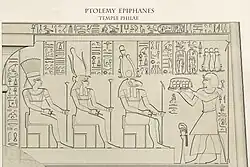 Ptolemy Epiphanes offers bread and the scent of incense to the gods Amun, Mut, and Khnum
