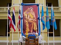The displays of the national flag along with the Flag of the Royal Ceremonial of the Queen's 6th Cycle Birthday Anniversary.
