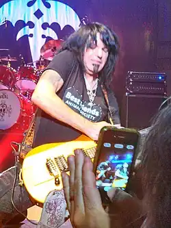 Sarzo performing with Geoff Tate in 2013