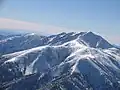 Aerial view of Rogers Peak and Telescope Peak in winter. Camera pointed south.