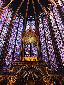 A hall with lights and windows. It is a picture of the Sainte-Chaplle.
