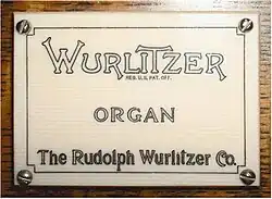 The Rudolph Wurlitzer Company logo on a pipe organ