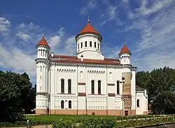 A large white church against a blue sky
