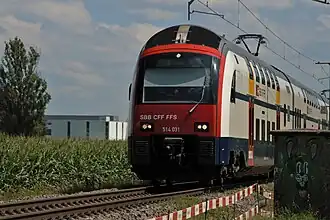 Double-deck train white blue red