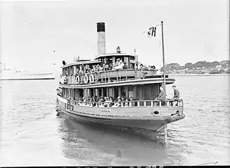 In her last year as a steamer with updated yellow and green painted livery