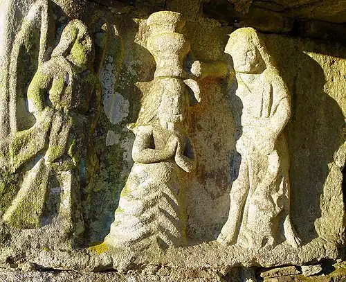 Baptism of Jesus by John who pours water while angel holds Jesus' cloak.
