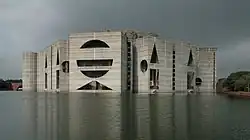 Facade of building across artificial lake