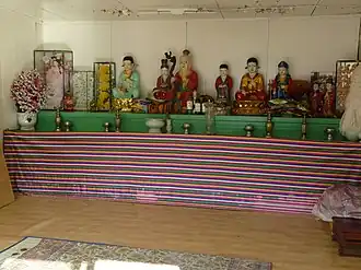 Indoor Asian shrine.