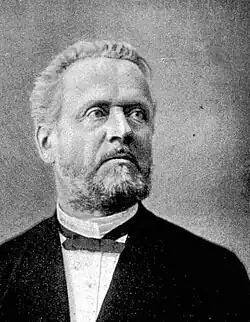 Black and white portrait photograph of Simon Schwendener