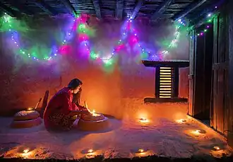 Image 19Woman lighting a diyo during Tihar, by Mithun Kunwar (edited by Radomianin) (from Wikipedia:Featured pictures/Culture, entertainment, and lifestyle/Religion and mythology)