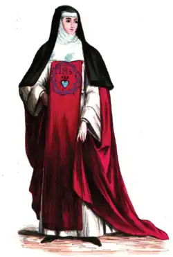 The religious habit of the Sisters of the Incarnate Word and Blessed Sacrament is white, with a red scapular and a black veil.