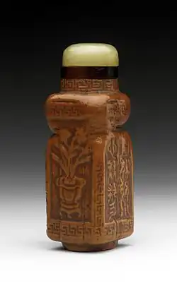 Chinese snuff bottle (biyanhu) with body from a gourd grown inside a mould, and a jade stopper