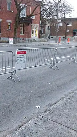 Metal barricades with signs