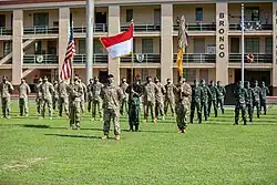 Soldiers assigned to 3rd Squadron, 4th Cavalry Regiment, 3rd Infantry Brigade Combat Team, 25th Infantry Division stand together in formation with Soldiers assigned to the Indonesian Army's 431st Para Raider Infantry Battalion during the opening ceremony of the U.S