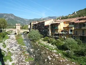 A view of Sospel, with the River Bévéra flowing beneath the old bridge