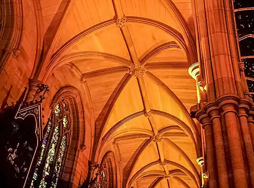 The aisles have ribbed stone vaulting with carved bosses