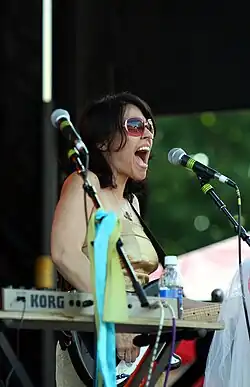 Stephanie Morgan singing and playing guitar