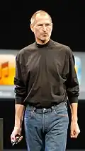 Steve Jobs wearing his signature black mock turtle neck by Issey Miyake[9]