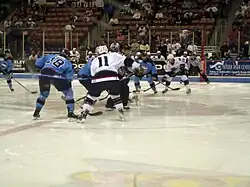 South Carolina Stingrays and Charlotte Checkers battle for control of the puck at a center ice face off; Charlotte Checkers at South Carolina Stingrays, April 17, 2009.