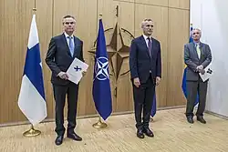 Finnish and Swedish ambassadors submit their applications to join NATO to then-secretary general Jens Stoltenberg.