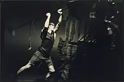 A man trowing to the floor a mic stand.