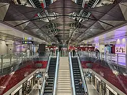 Symmetrical view of the TEL station with stainless steel panels on the roof