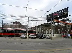 large building with transport vehicles on rails entering and exiting