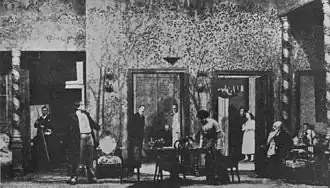 black and white photo of a set of a room on a stage