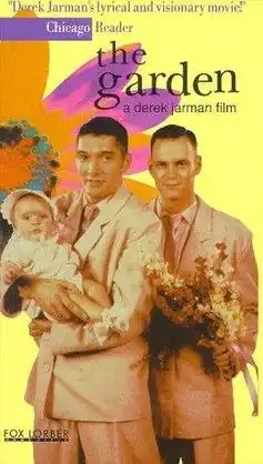 a male couple in suits on a colorful background depicting a flower. The one on the left holds a baby and the one on the right holds a bouquet.