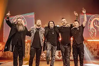 Three Days Grace in 2023 (L–R: Barry Stock, Neil Sanderson, Matt Walst, Adam Gontier and Brad Walst)