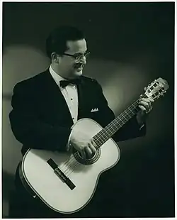Tony Bradan in 1968, playing classical guitar