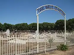 Cemetery and gates with town name