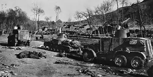 Type 92 Chiyoda armored car and a Type 92 tankette entering a Chinese village; 1930s