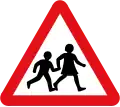 UK road sign warning of schoolchildren, one of the pictographic signs designed by Calvert ahead of the 1963 Worboys Review